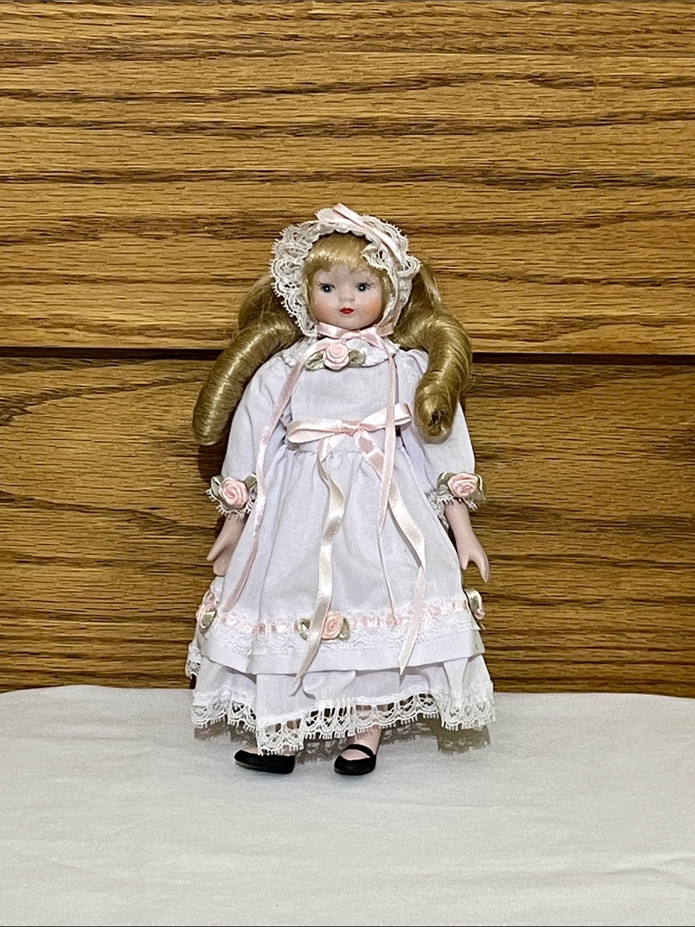 Vintage-Style Pink and White Porcelain Doll in Lace Dress